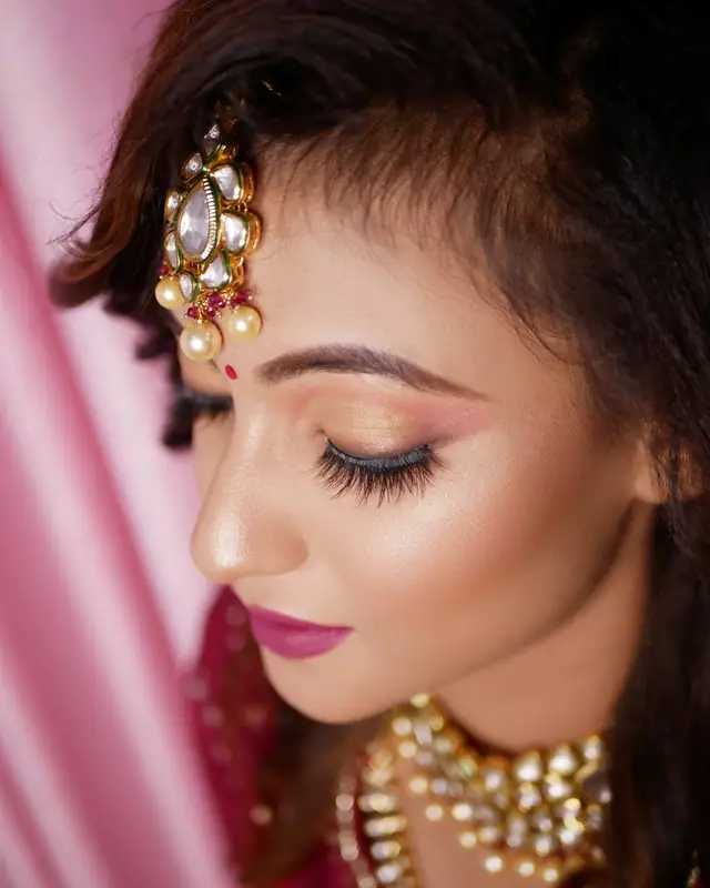 Close-up of bridal eye make-up and jewellery